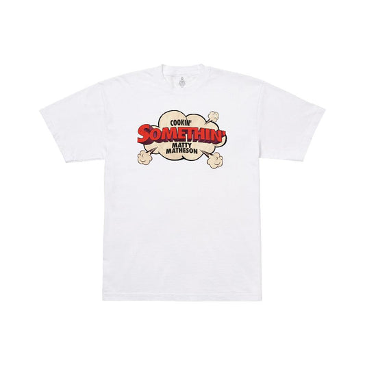 Cookin' Somethin' Original T-Shirt featuring a white cotton tee with vintage-style cooking show graphic design in red and beige tones, displaying retro cloud-shaped logo with steam puffs on the front chest area of the shirt