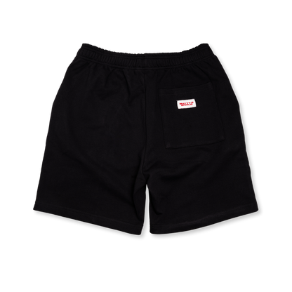 Black shorts with a small logo on a white background