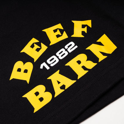 Black sweatshirt with yellow text 'BEEF BARN 1982' on a black background