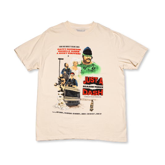 Beige t-shirt with a graphic design featuring characters and text on a white background