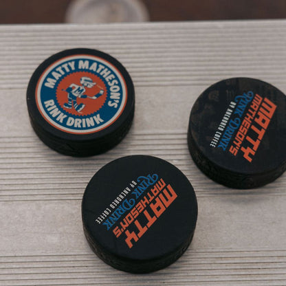 Anchored x Matty Rink Drink Hockey Puck Anchored Coffee Hockey PuckMatty Matheson