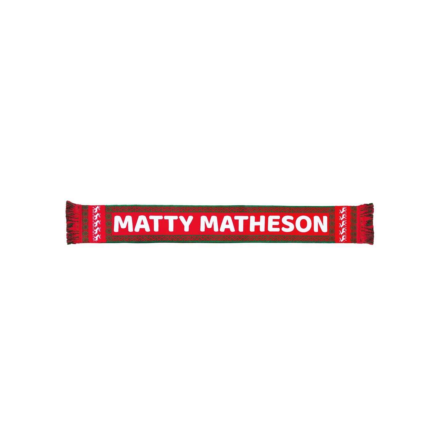 The Matty Holiday Scarf by the man who acts as Fak in the Bear is a vibrant holiday accessory with MATTY MATHESON in bold white letters on a red background, framed by green edges. Made from 100% acrylic, it features festive white patterns at both ends.
